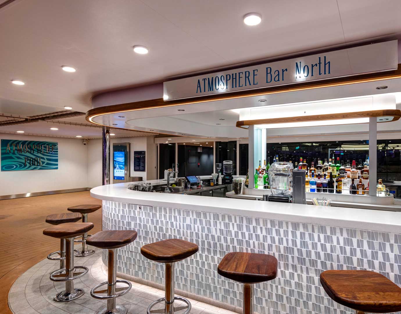Atmosphere Bar North with wooden stools and a well-stocked counter on an MSC Cruises ship | MSC Cruises