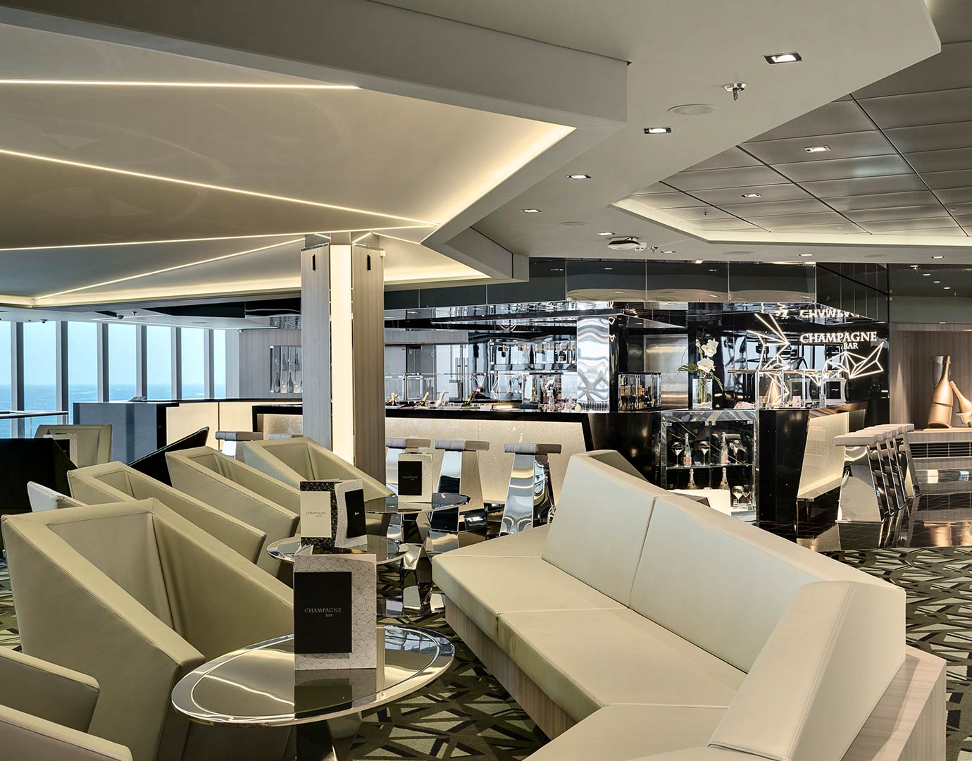 Luxurious champagne bar with modern seating and ocean views onboard | MSC Cruises
