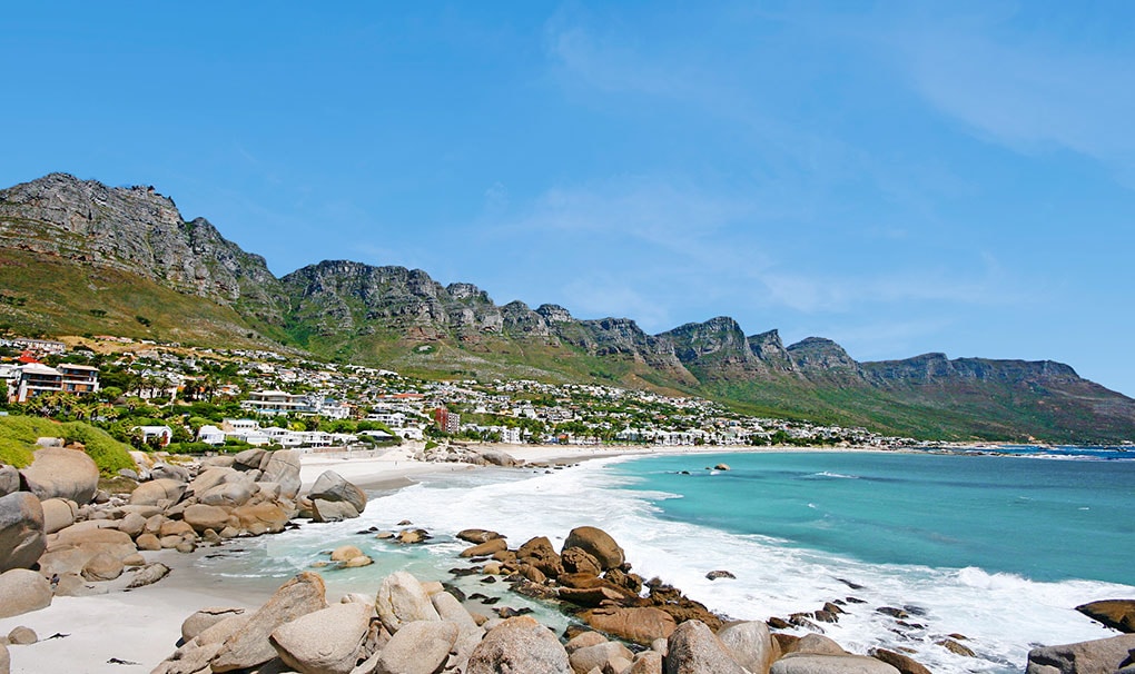 Scenic coastal view of Camps Bay with turquoise waters and the Twelve Apostles mountain range | MSC Cruises