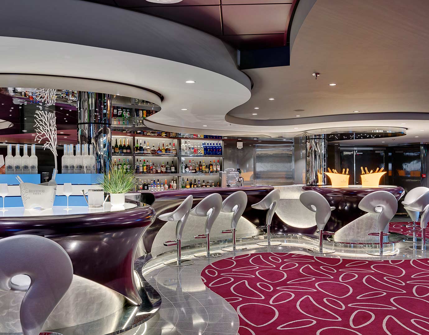 Modern cruise ship bar with sleek seating, vibrant decor, and a wide selection of drinks | MSC Cruises