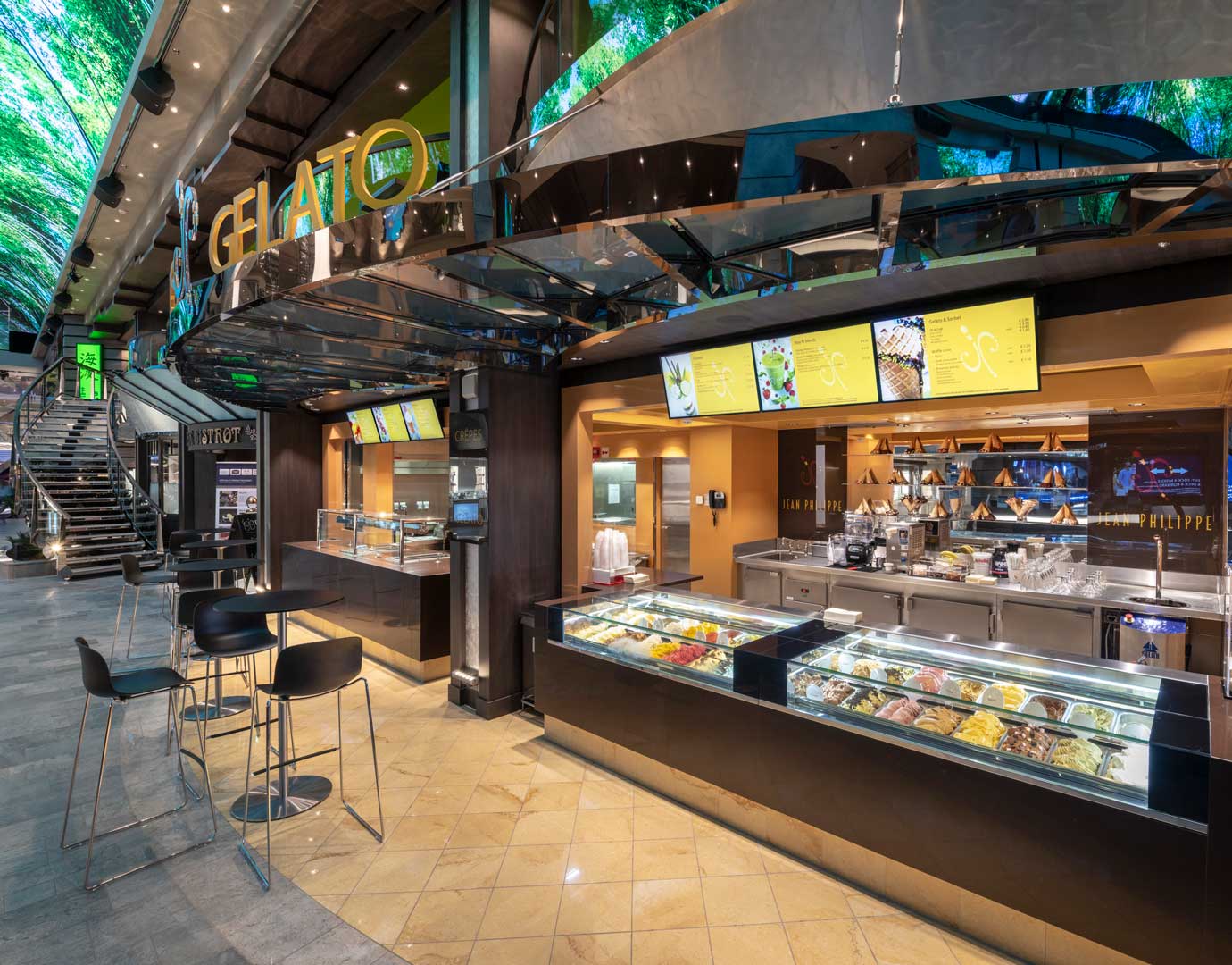Gelato counter with colorful ice cream displays and seating on an MSC Cruises ship | MSC Cruises