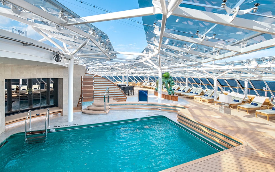 Luxurious pool area with sunbeds and ocean views on an MSC cruise ship | MSC Cruises