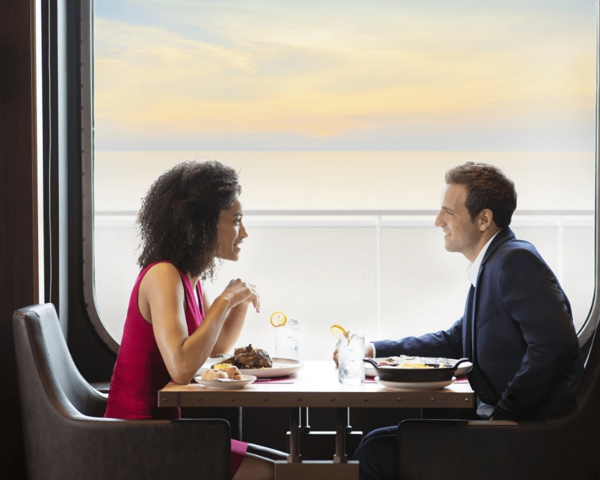 A man and woman dining on board MSC Cruises ship MSC Grandiosa.
