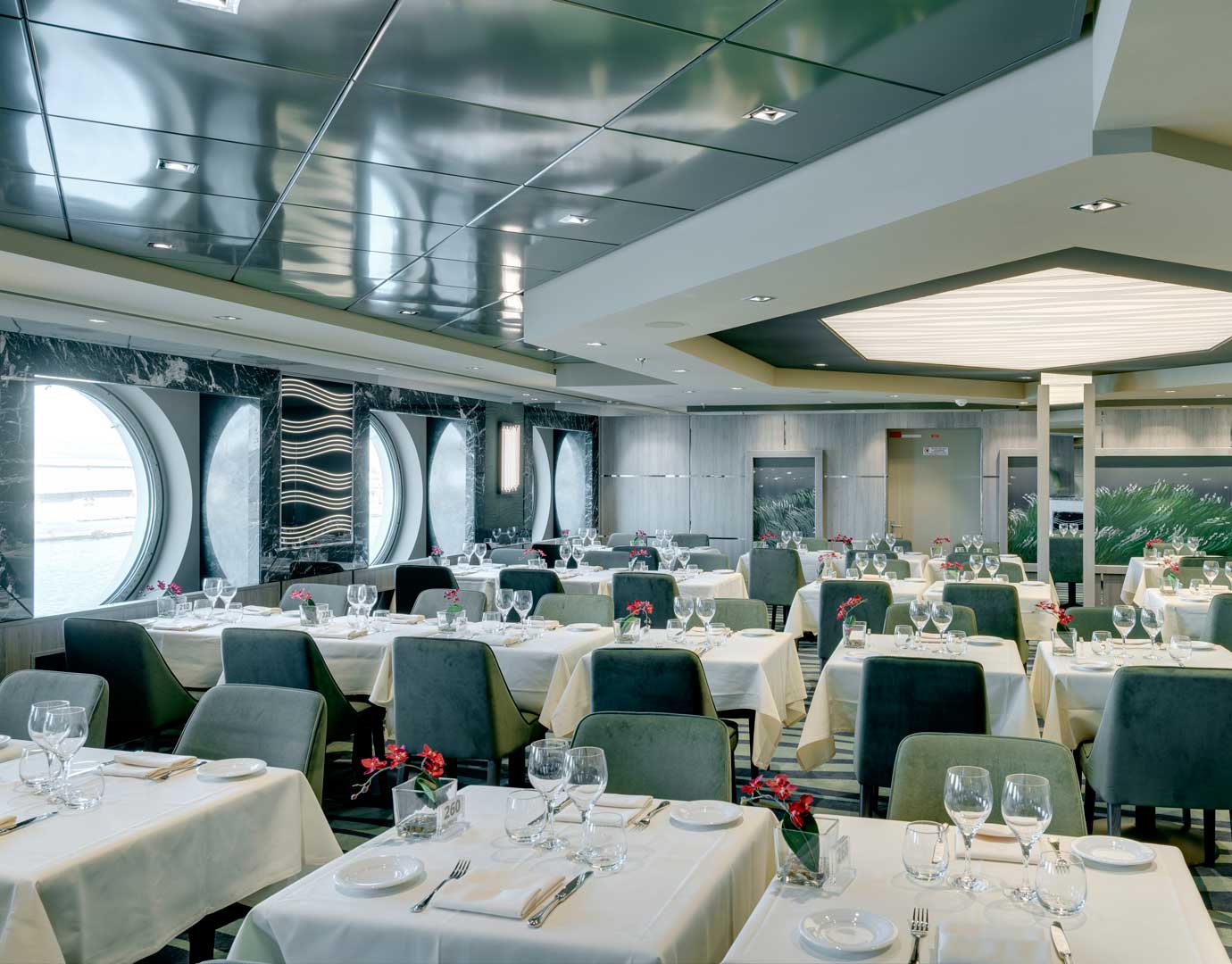 Elegant dining room with ocean views and modern decor onboard MSC Cruises | MSC Cruises