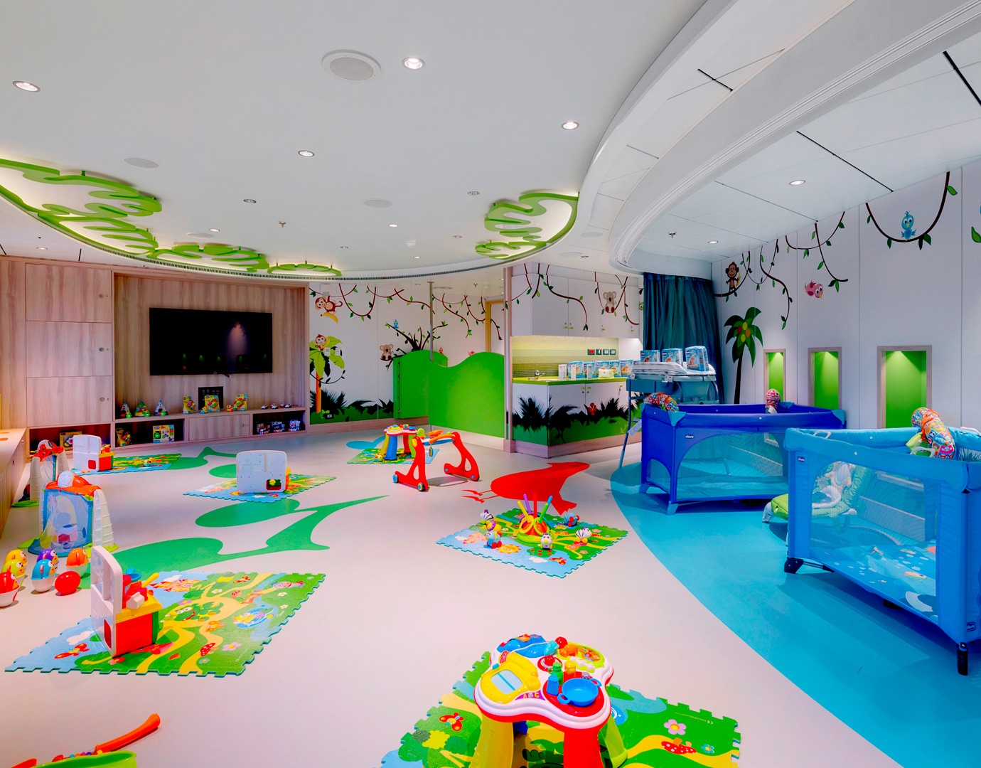 Colorful children's playroom with jungle theme and baby cribs onboard | MSC Cruises