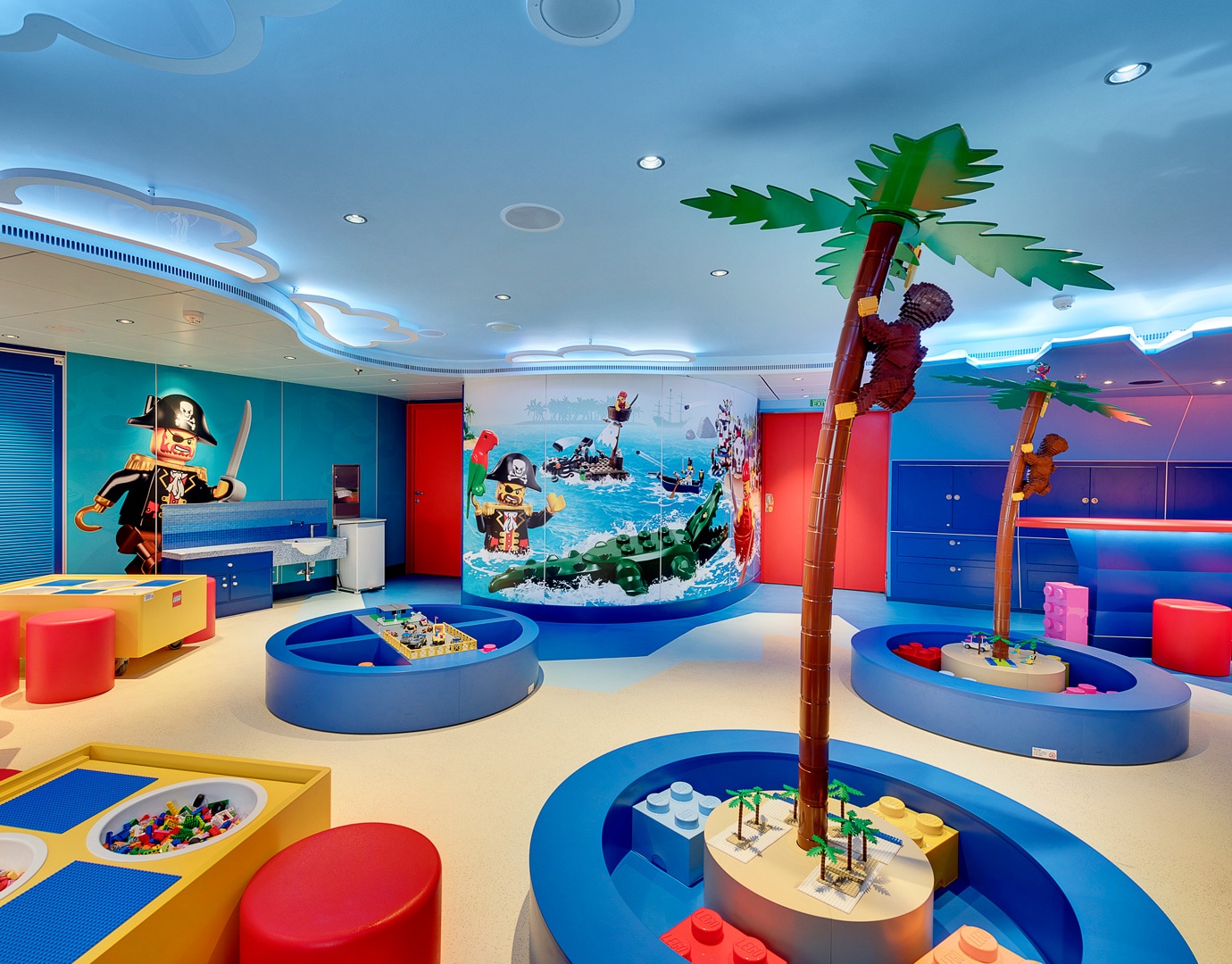 Colorful LEGO-themed kids' playroom with pirate decor and palm tree structures | MSC Cruises