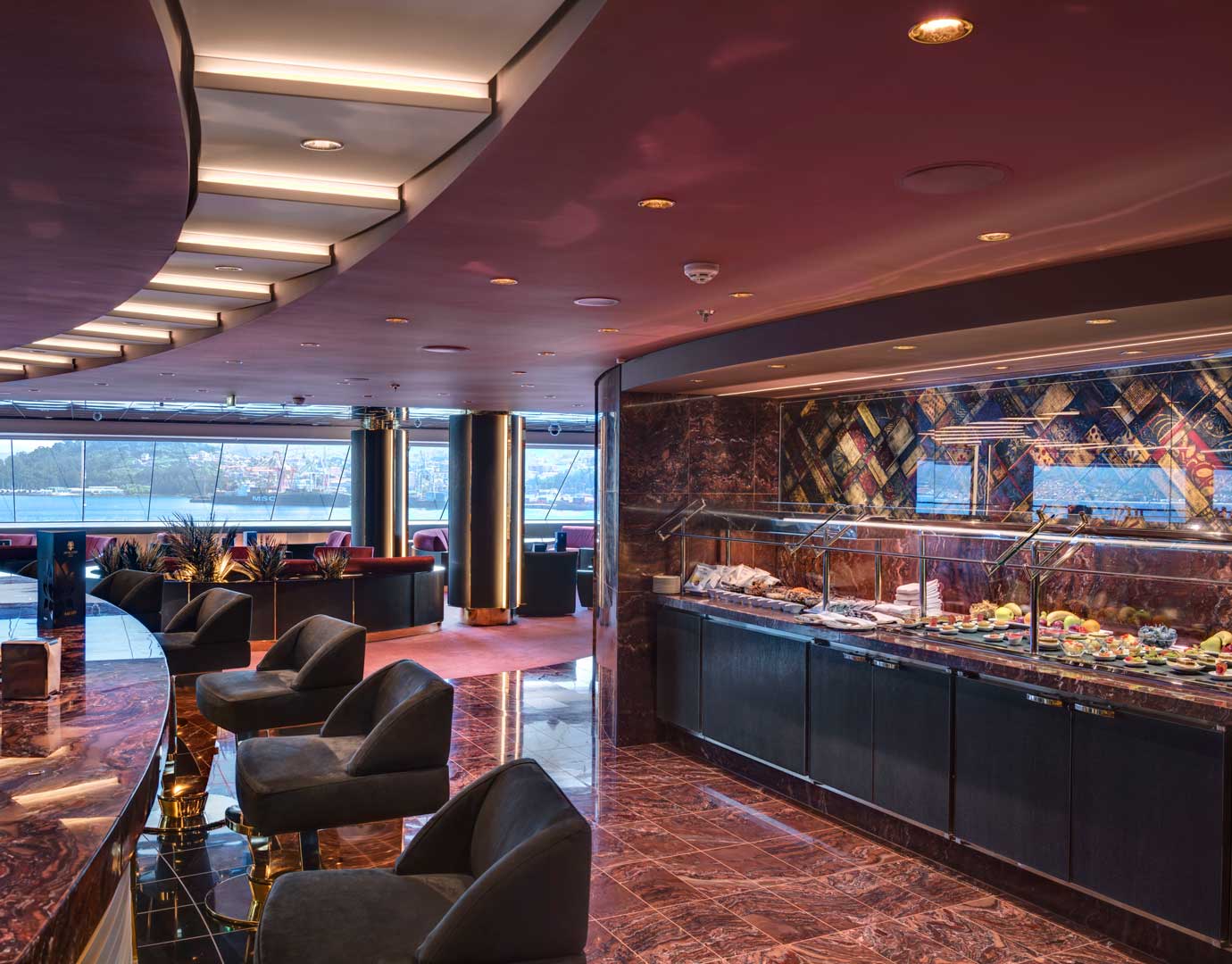 Elegant onboard buffet area with panoramic ocean views and luxurious seating | MSC Cruises