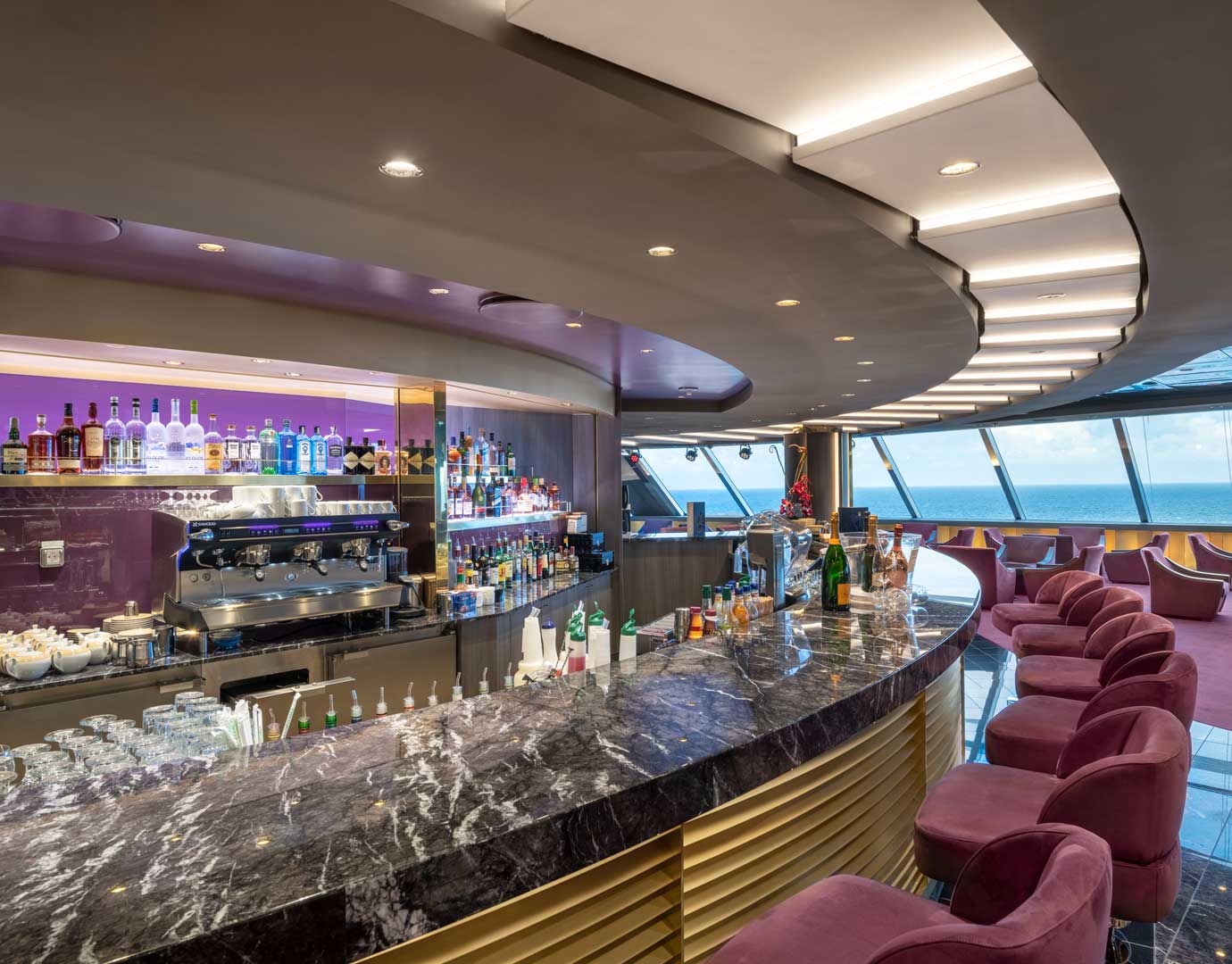 Elegant onboard bar with ocean views and plush seating | MSC Cruises