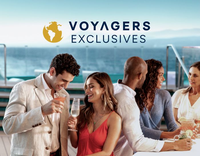 Couple enjoying drinks on the deck of an MSC cruise ship. The Voyagers Exclusive logo is overlayed on the image above their heads.