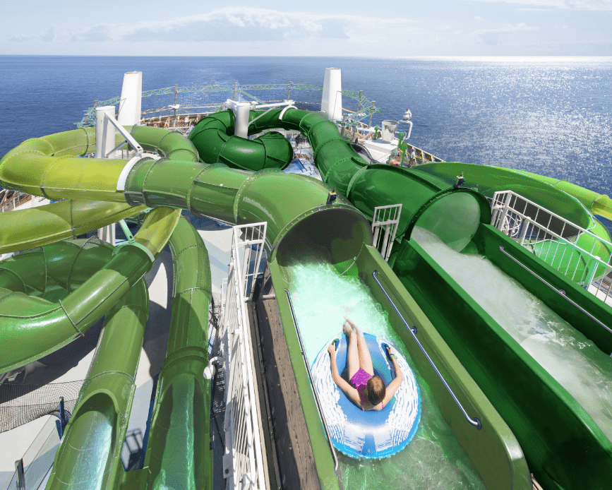 Person an inner tube about to go down a winding water slide on MSC Cruises ship MSC Grandiosa.
